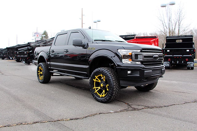 Custom Black F-150 with Jimmie Allen Yellow Rims at All American Auto Group in Old Bridge NJ